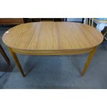 A teak extending dining table