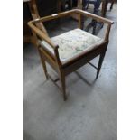 An Edward VII inlaid mahogany piano stool