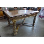 A 19th Century French oak extending dining table, 78cms h, 135cms l, 100cms w
