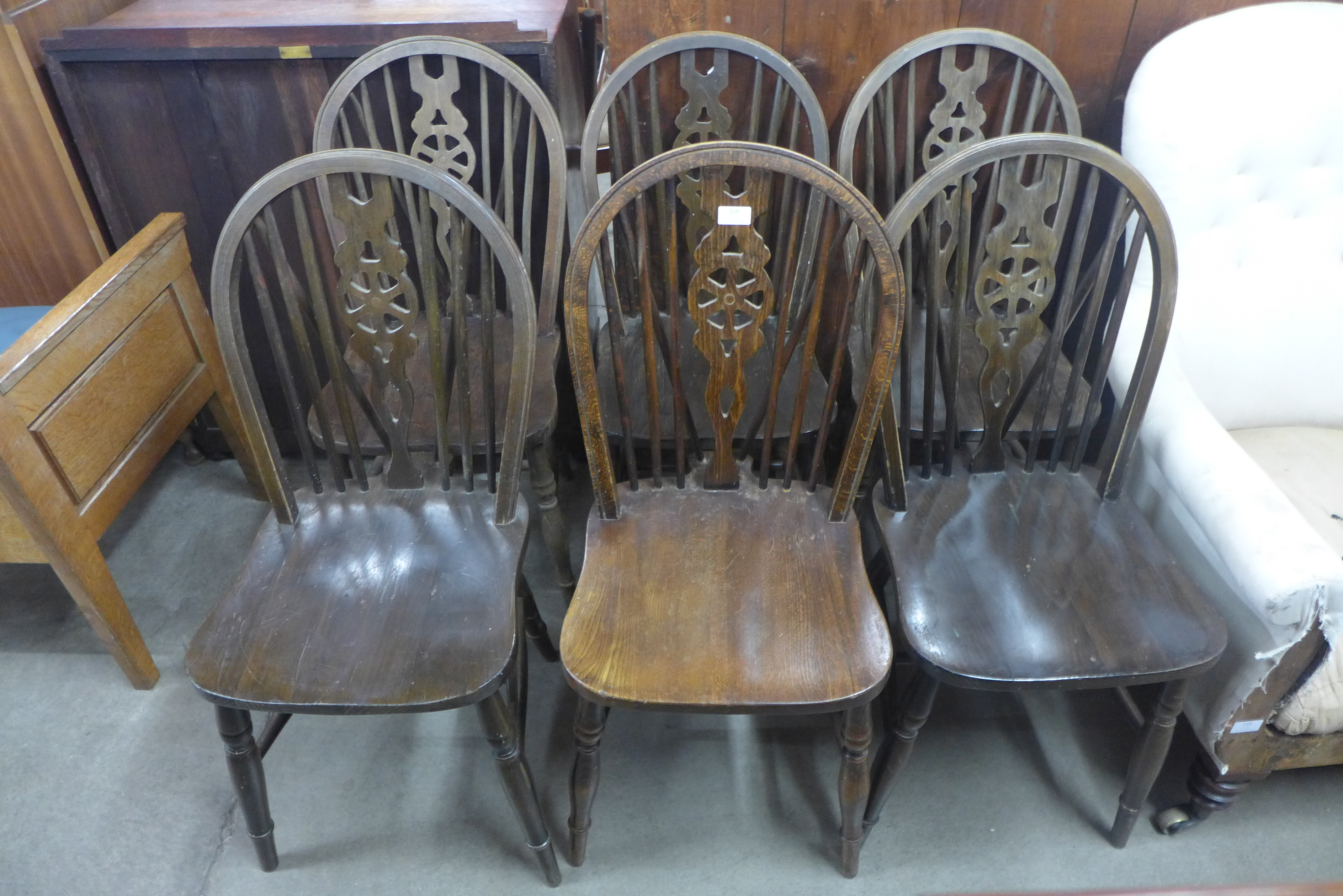 A set of six beech wheelback chairs