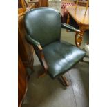 A 1930's mahogany and green leather revolving desk chair