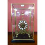 A cased brass fusee skeleton clock, 53cms h