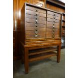 A Victorian oak tambour front sixteen drawer office cabinet, 115cms h, 86cms w, 40cms d