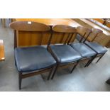 A set of four teak dining chairs