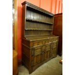 A carved Ipswich oak dresser, 173cms h, 137cms w, 46cms d