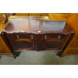 A mahogany serpentine sideboard