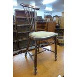 An Arts and Crafts mahogany bedroom chair, attributed to Liberty & Co.