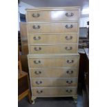 A George III style bleached walnut chest on chest