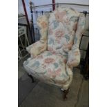 A Queen Anne style mahogany and upholstered wingback armchair