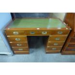 A yew wood campaign style pedestal desk