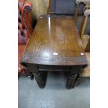 A carved oak barleytwist gateleg table