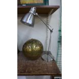 An anglepoise desk lamp and a pierced brass spherical hanging light pendant