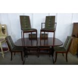 A McIntosh Ambassador range mahogany extending dining table and six dining chairs