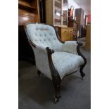 An early Victorian rosewood and upholstered armchair, 91cms h, 69cms w, 85cms d