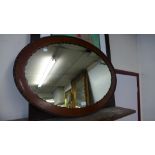 An Edward VII mahogany oval framed mirror