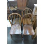 A Harlequin set of four elm and beech kitchen chairs