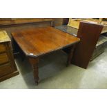 A Victorian mahogany extending dining table