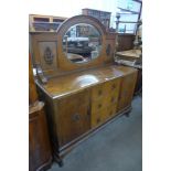 An early 20th Century oak mirrorback sideboard