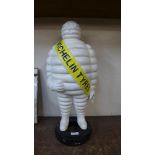 A cast iron Michelin Man advertising figure