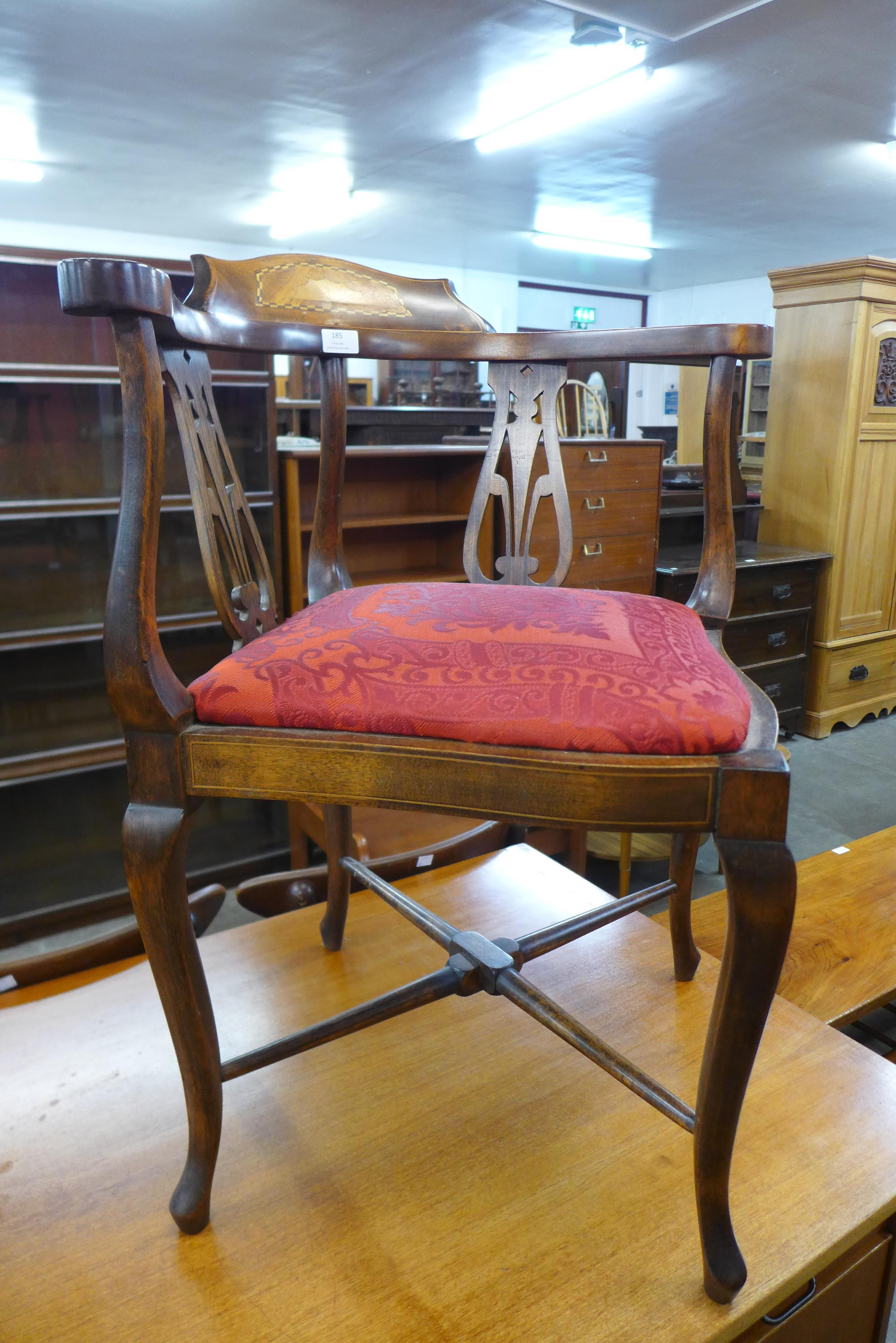 An Edward VII inlaid mahogany elbow chair