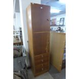 A tall light oak office locker cabinet