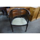 An Edward VII inlaid mahogany tub chair