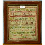 A Victorian sampler, dated 1883, 29 x 24cms, framed