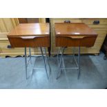 A pair of teak and chrome bedside tables