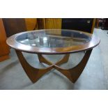 A G-Plan Astro teak and glass topped circular coffee table (glass chipped)