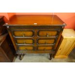 A Jacobean Revival oak geometric moulded chest of drawers, 108cms h, 92cms w, 48cms d