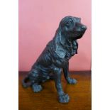 A bronze figure of a seated spaniel, 36cms h