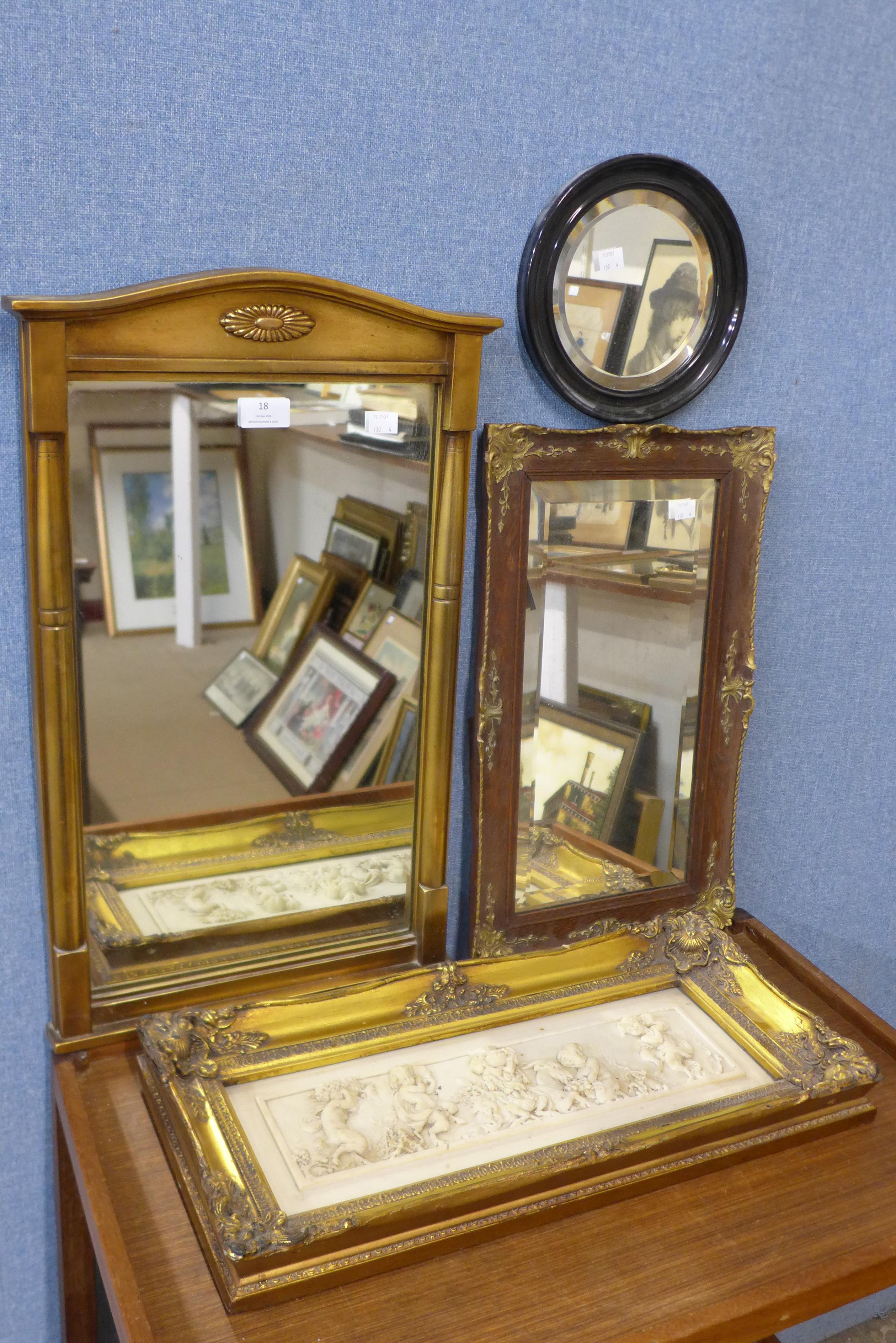 A small gilt framed pier mirror, a faux marble plaque depicting cherubs and two other mirrors