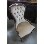 A Victorian style mahogany and upholstered nursing chair