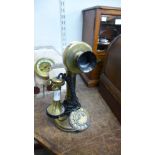 A brass candlestick telephone