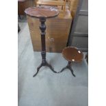 A mahogany torchere and a wine table