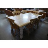 A painted beech farmhouse kitchen table (74cms h, 184cms l, 99cms w) and six beech chairs