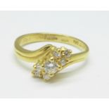 An 18ct gold, seven stone diamond crossover ring, 3.3g, M