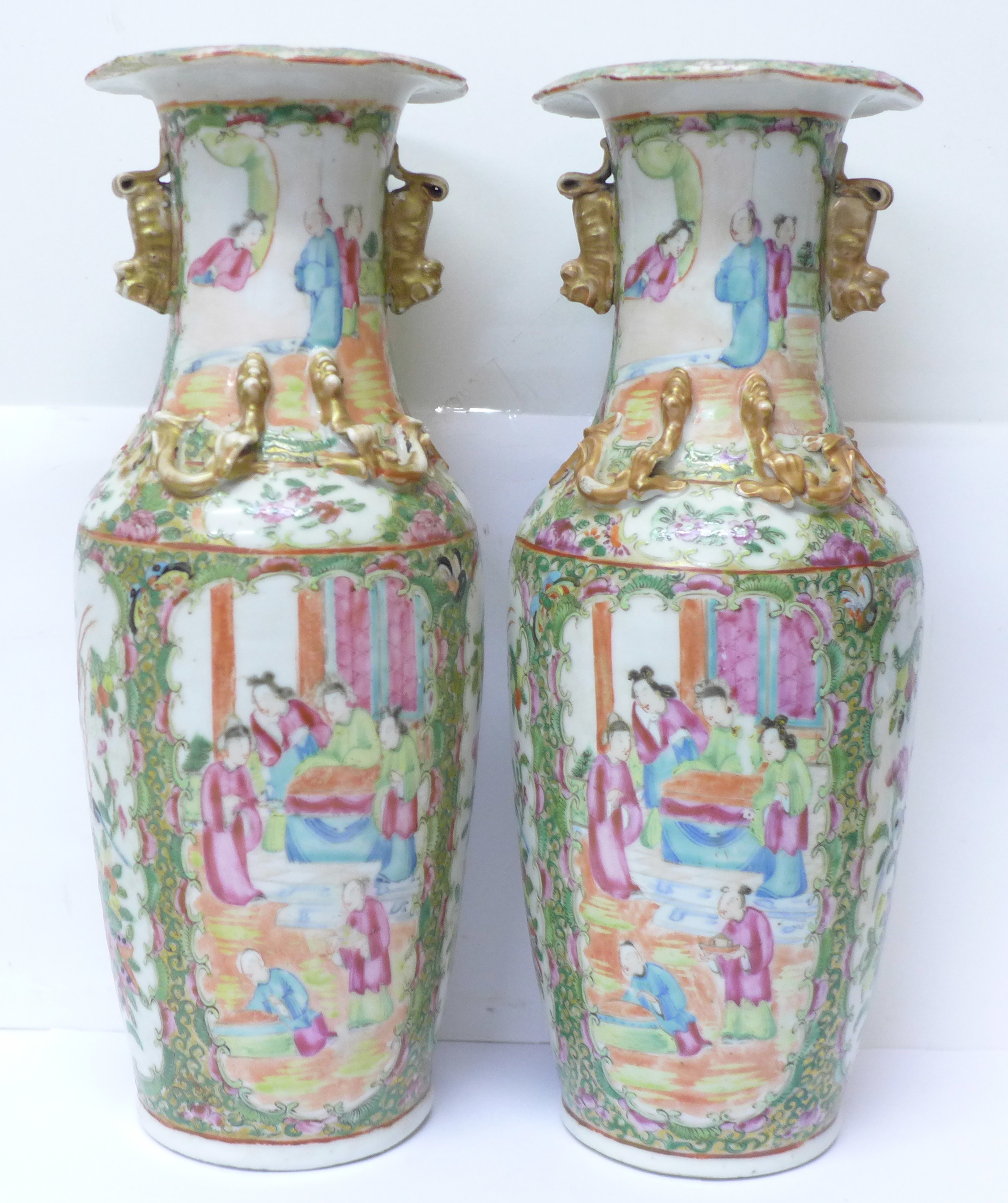 A pair of 19th Century Chinese export Canton Rose Medallion porcelain vases, with applied dragons