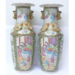 A pair of 19th Century Chinese export Canton Rose Medallion porcelain vases, with applied dragons