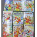 A collection of sixteen Rupert annuals