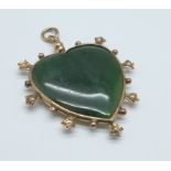 A c1900 9ct gold and jade heart shaped pendant, width 37mm