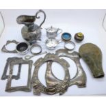 Three silver condiments, plated jug, etc., and silver picture frame fronts