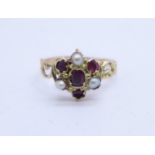 A Victorian yellow metal, pearl and red stone cluster ring, (tests as gold), 1.6g, O