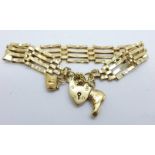 A 9ct gold gate bracelet with two 9ct gold charms, 11g