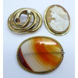 A Victorian gilt metal cameo brooch, a gilt metal agate brooch and one other gilt metal brooch