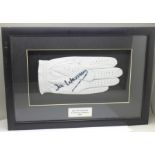 A framed and mounted signed glove by 1991 US Masters Champion, Ian Woosnam