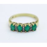 A 9ct gold, four green stone ring, 2.5g, O