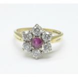 An 18ct gold, ruby and diamond cluster ring, 3.8g, N