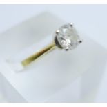 A yellow metal and diamond solitaire ring, one carat diamond weight, (certificate card marked 18ct
