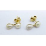 A pair of pearl drop earrings, (test as 9ct gold)